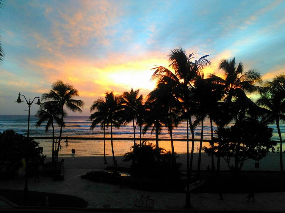 beach sunset at waikiki in honolulu hawaii