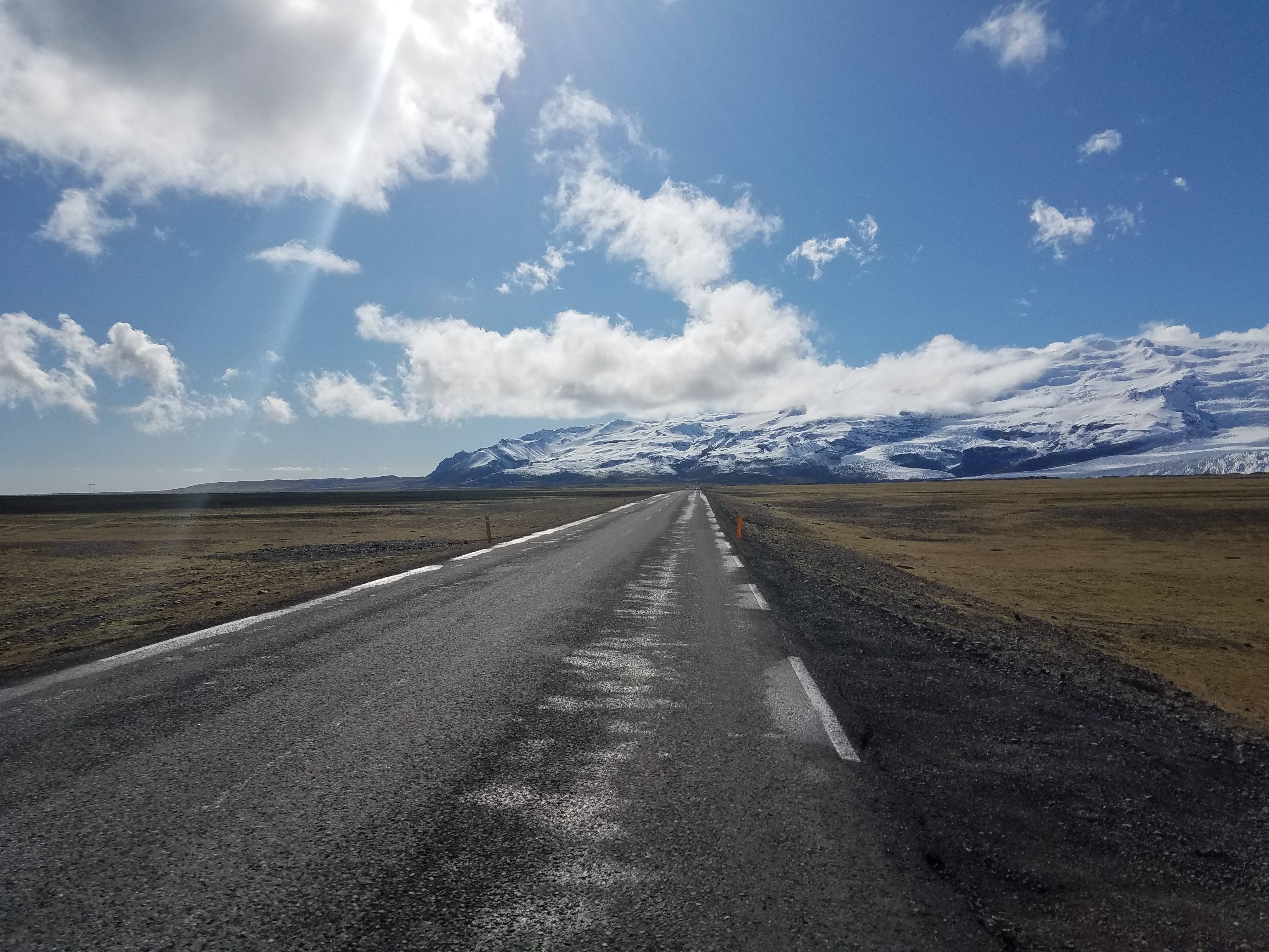 open road in iceland with mountain view