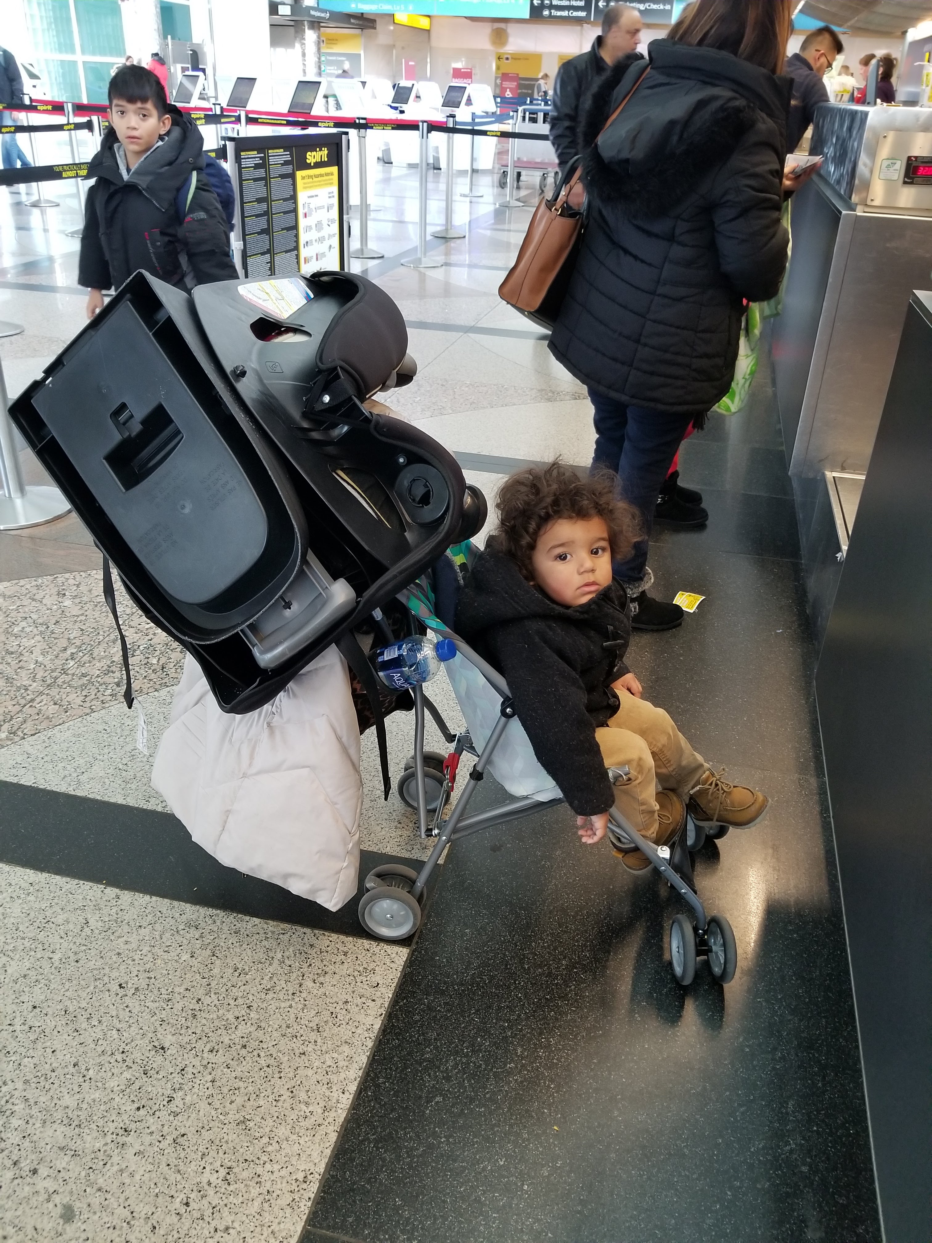 solo travel with toddler car seat in airport