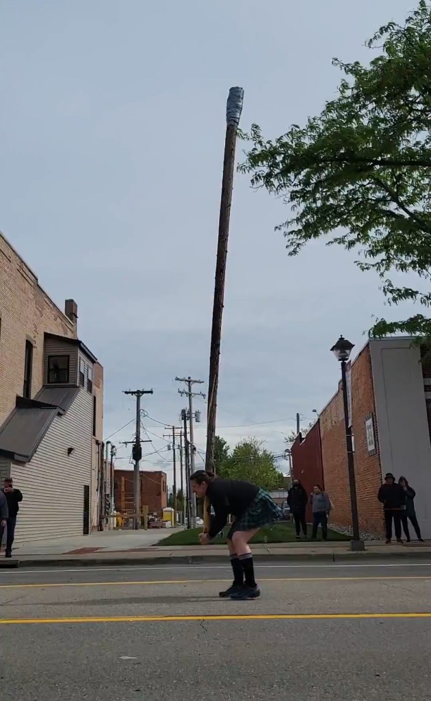 caber toss at highland games in alma michigan