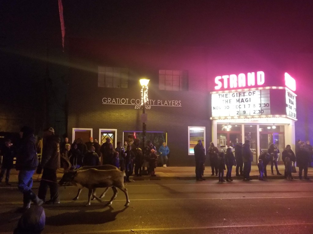 Reindeer walking by Strand Theater, home to Gratiot County Players Alma michigan